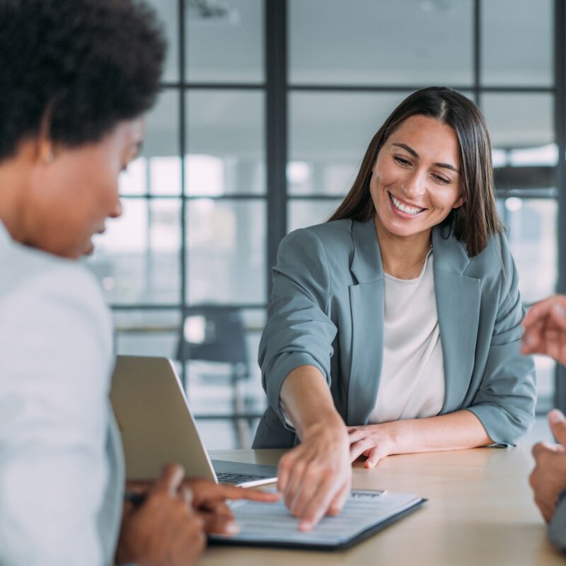 Business people signing a contract in the office. content-image