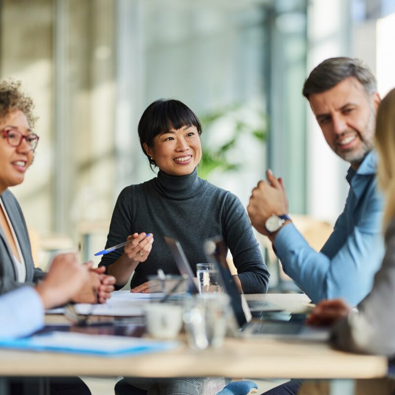 Happy multiracial business team talking on a meeting in the office. content-image